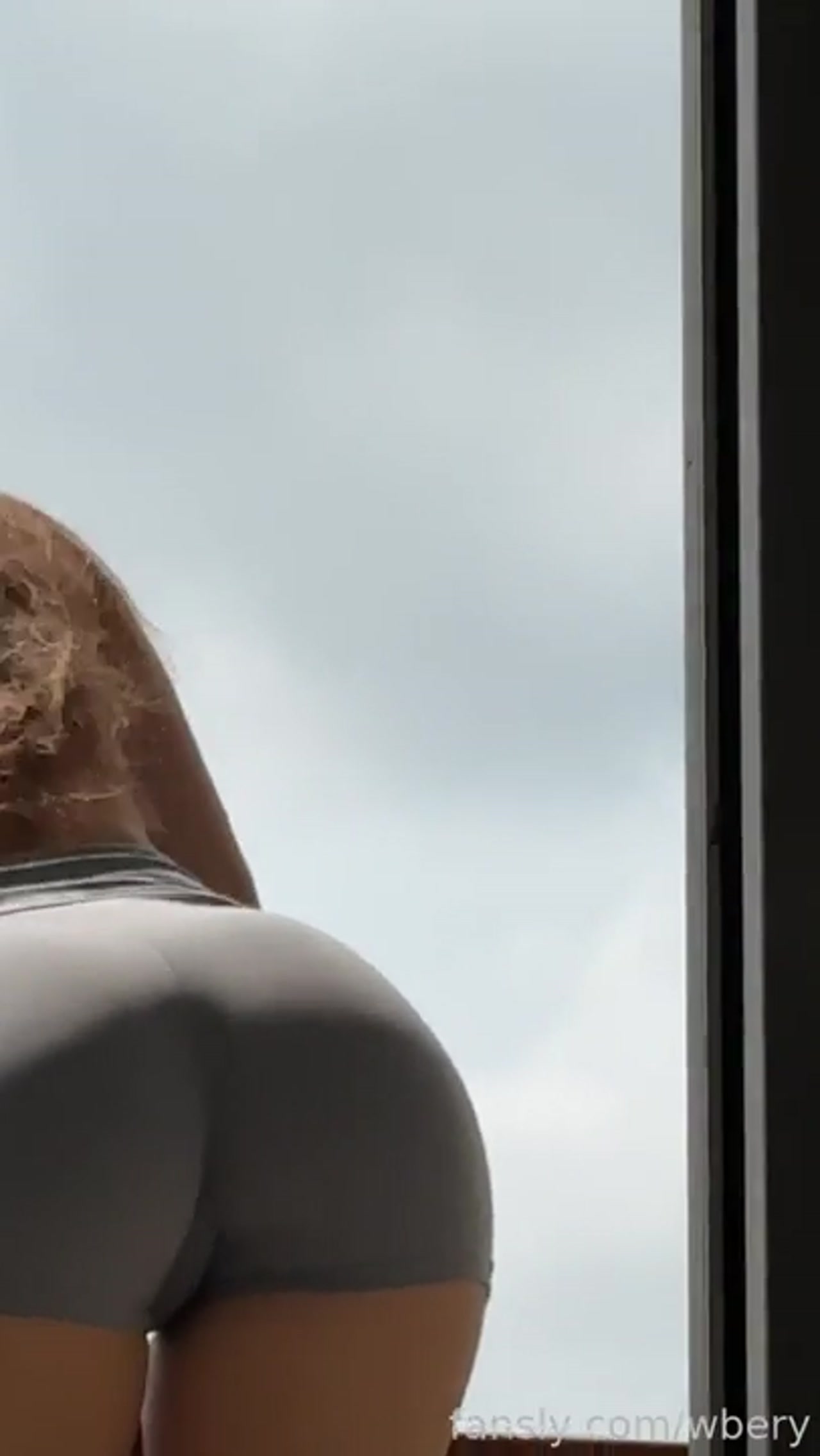 She's standing on a balcony with
